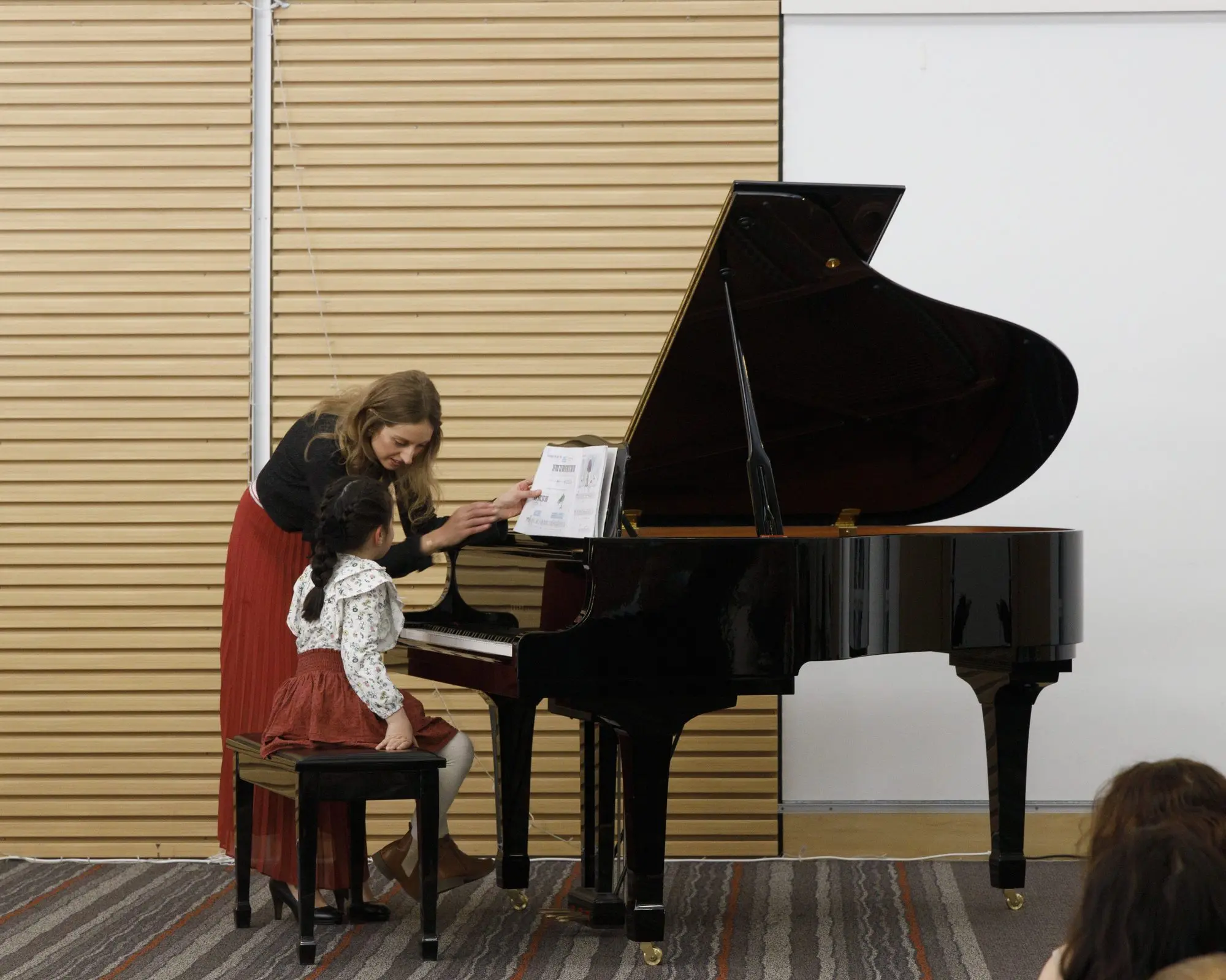 Nadine teaching piano